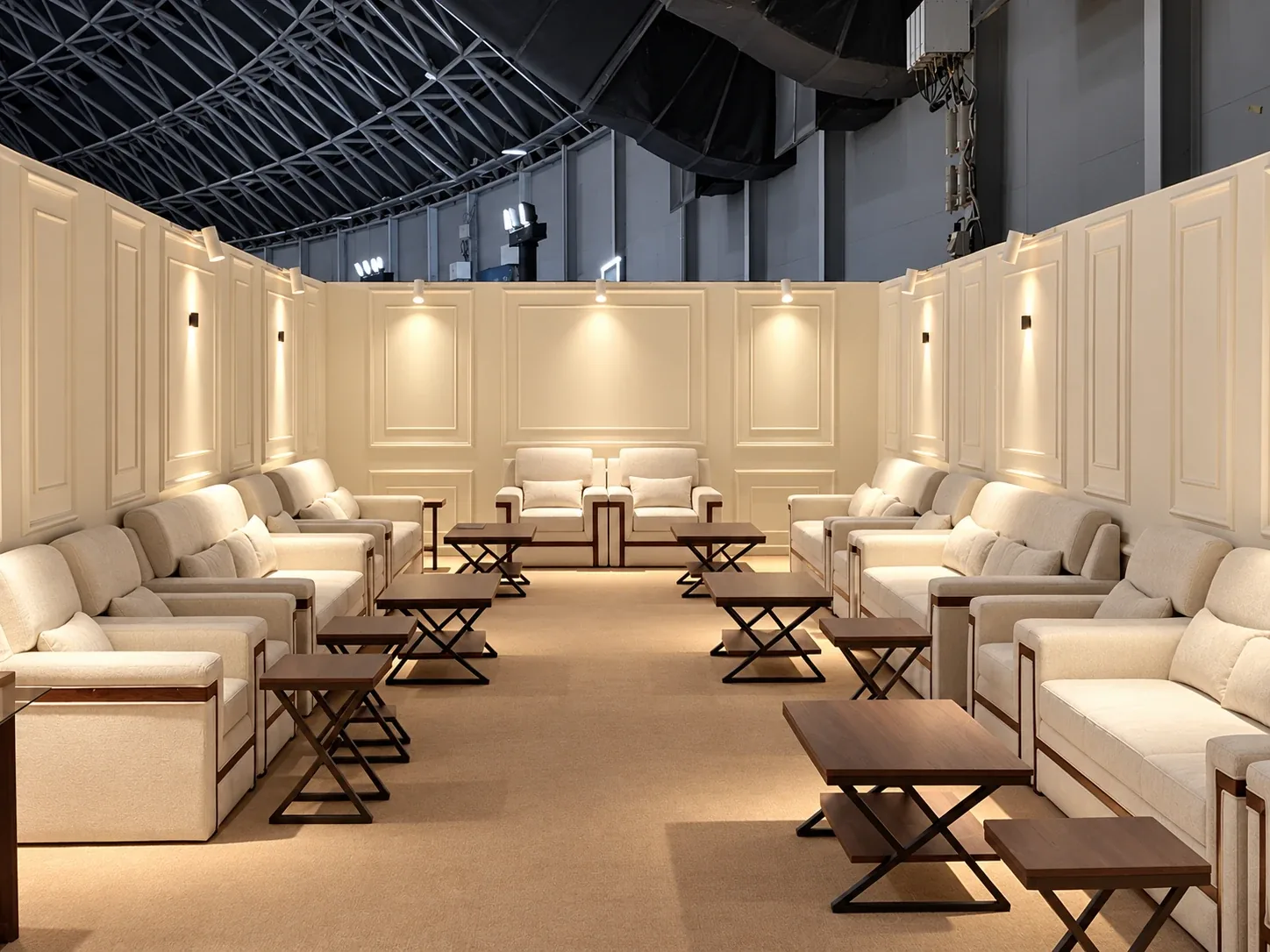 Cream reception sofas in an exhibition booth